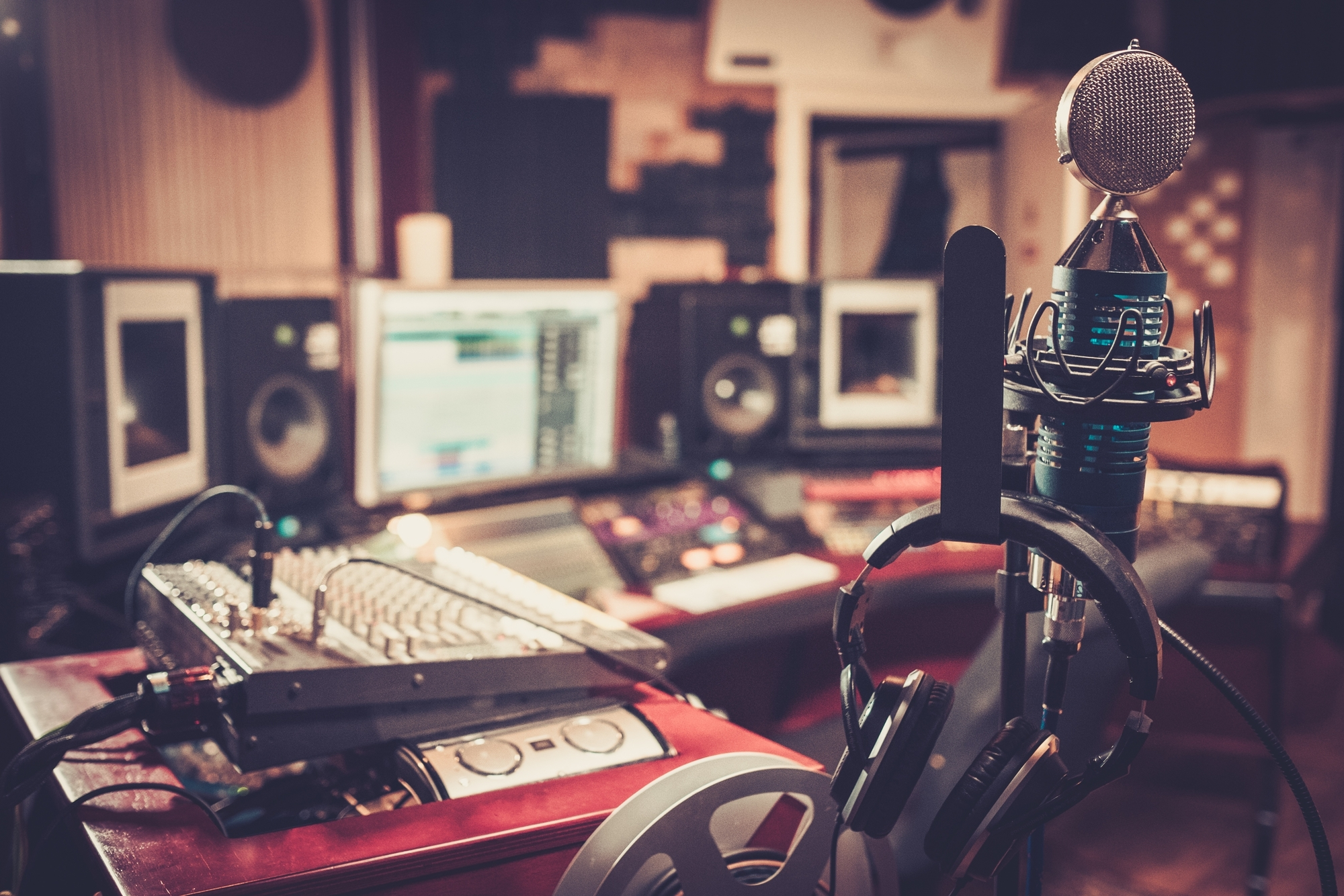 Man with a Striped Shirt Listening to Music